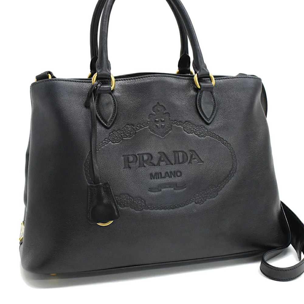 Prada handbag embossed leather triangle plate